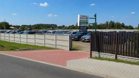 Parking Arkadia — tablica przy wjeździe z adresem i numerem telefonu